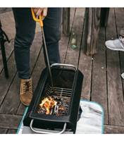 the curved point hooks onto the FirePit's fuel rack for easy adjustment to the charcoal or wood setting