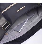 Main compartment has zippered pocket, key leash and two open slip pockets